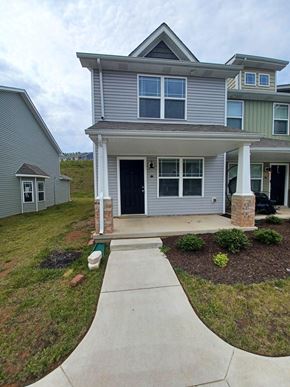 Clarksville house for rent - A house with a grey front and a black car in the driveway.