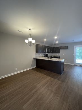 Clarksville house for rent - a view of a kitchen and living room in an empty home