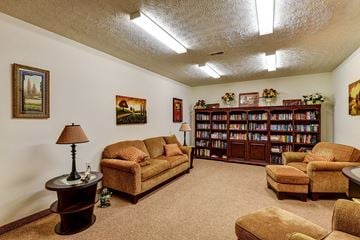 Athens apartment for rent - a living room filled with furniture and a book shelf