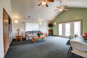 Berkeley Springs apartment for rent - a living room with a couch and a dining room table