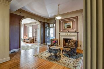 Tiffin apartment for rent - a living room with two chairs and a fireplace