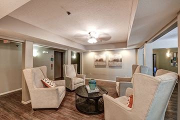 Tiffin apartment for rent - a living room with couches and chairs and a table