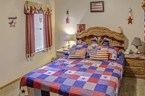 Washington Court House apartment for rent - a bedroom with a bed with a checkered quilt