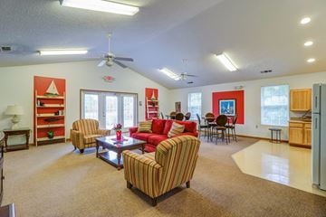Hardeeville apartment for rent - a living room with couches and chairs and a table