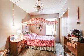 Carrollton apartment for rent - a bedroom with a bed and a dresser