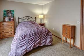 Clyde apartment for rent - a bedroom with a bed and two dressers