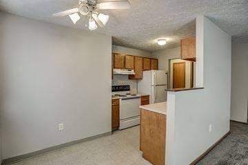 Fremont apartment for rent - a kitchen with white appliances and wooden cabinets