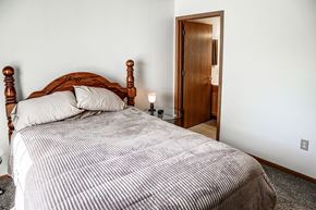 Jamestown apartment for rent - a bedroom with a bed and a door to a bathroom