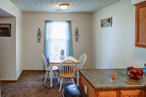 Jamestown apartment for rent - a dining room with a table and chairs and a counter