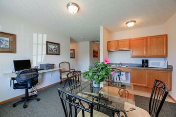 Loudonville apartment for rent - a kitchen and dining room with a glass table and chairs