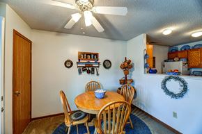 Barnesville apartment for rent - a dining room with a table and chairs and a ceiling fan