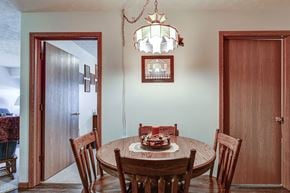 Barnesville apartment for rent - a dining room with a table and chairs and a chandelier
