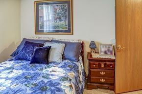 Grayson apartment for rent - a bedroom with a bed and a dresser