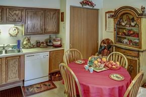 Grayson apartment for rent - a kitchen with a table with a pink tablecloth