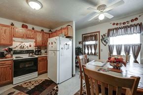 Cadiz apartment for rent - a kitchen with a dining table and a refrigerator