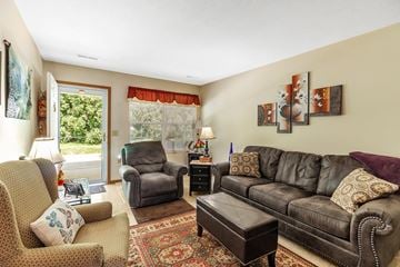 Coldwater apartment for rent - a living room with couches and chairs and a rug