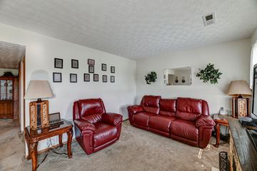 Crestline apartment for rent - a living room with two red leather couches