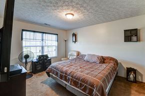Crestline apartment for rent - a bedroom with a bed and a window