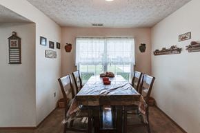 Crestline apartment for rent - a dining room with a table and chairs and a window