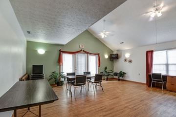Bridgeport apartment for rent - a living room with a table and chairs and a large window