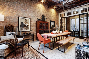 Chicago apartment for rent - a dining room with a table and chairs and a brick wall