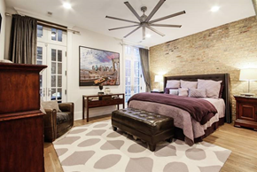 Chicago apartment for rent - a bedroom with a bed and a ceiling fan