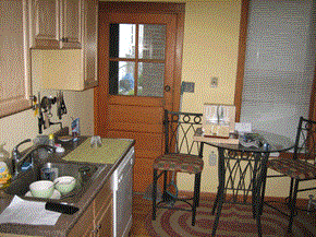 Chicago apartment for rent - a kitchen with a table and chairs and a sink