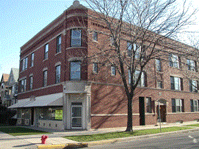 Chicago apartment for rent - a red brick building on the side of a street