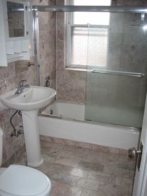 Chicago apartment for rent - a bathroom with a sink and a tub and a toilet