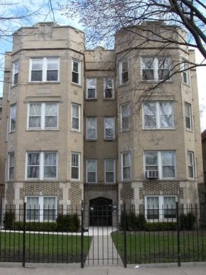Chicago apartment for rent - an apartment building with a black fence in front of it