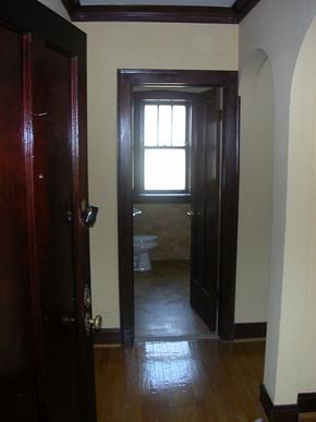 Chicago apartment for rent - a small bathroom with a toilet and a window