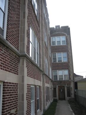 Chicago apartment for rent - a tall brick building with a tower on top of it
