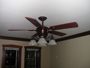 Chicago apartment for rent - a ceiling fan with three lights in a living room