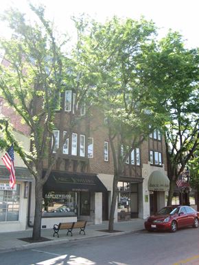 Glen Ellyn apartment for rent - a building with trees in front of it on a city street