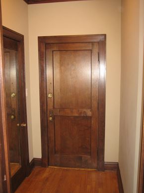 Chicago apartment for rent - a wooden door in a hallway with a wooden floor