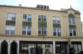 Chicago apartment for rent - the front of a tan brick building with windows