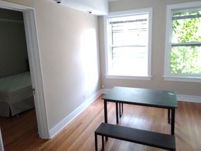 Chicago apartment for rent - a dining room with a table and two windows