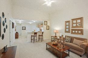 Danville apartment for rent - A living room with a couch, coffee table, and pictures on the wall.