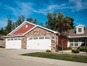 Westfield apartment for rent - A house with a red roof and two white garage doors.