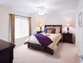 Westfield apartment for rent - A bedroom with a bed, nightstands, and a ceiling fan.