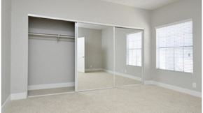 Westlake Village apartment for rent - an empty bedroom with a mirrored closet door