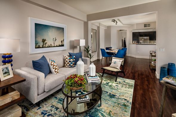 Los Angeles apartment for rent - A living room with a grey couch and a painting on the wall.