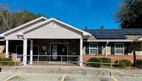 Lakeland apartment for rent - the front of a building with solar panels on the roof