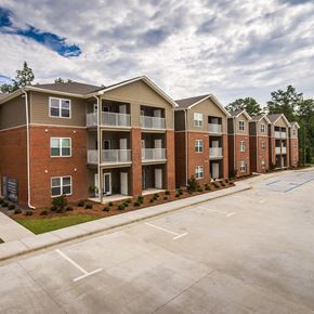 Macon apartment for rent - an empty parking lot in front of an apartment building