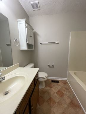Clarksville house for rent - A bathroom with a sink, toilet, and bathtub.