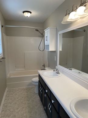 Clarksville house for rent - A bathroom with a white sink and a white toilet.