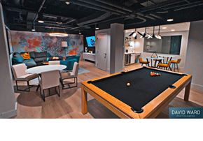 Cambridge apartment for rent - a game room with a pool table and tables