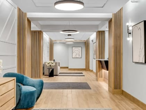 Cambridge apartment for rent - a lobby with a blue chair and a couch