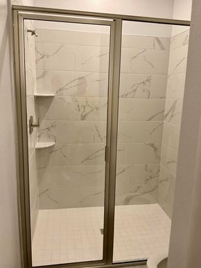 Orlando apartment for rent - a bathroom with a shower with a glass door