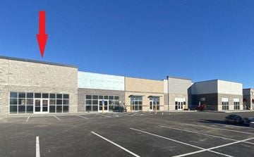 Cedar Rapids apartment for rent - an empty parking lot in front of a brick building